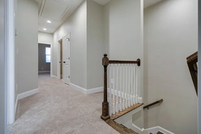a view of a hallway with staircase
