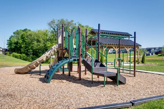 a view of patio with a table and chairs under an umbrella