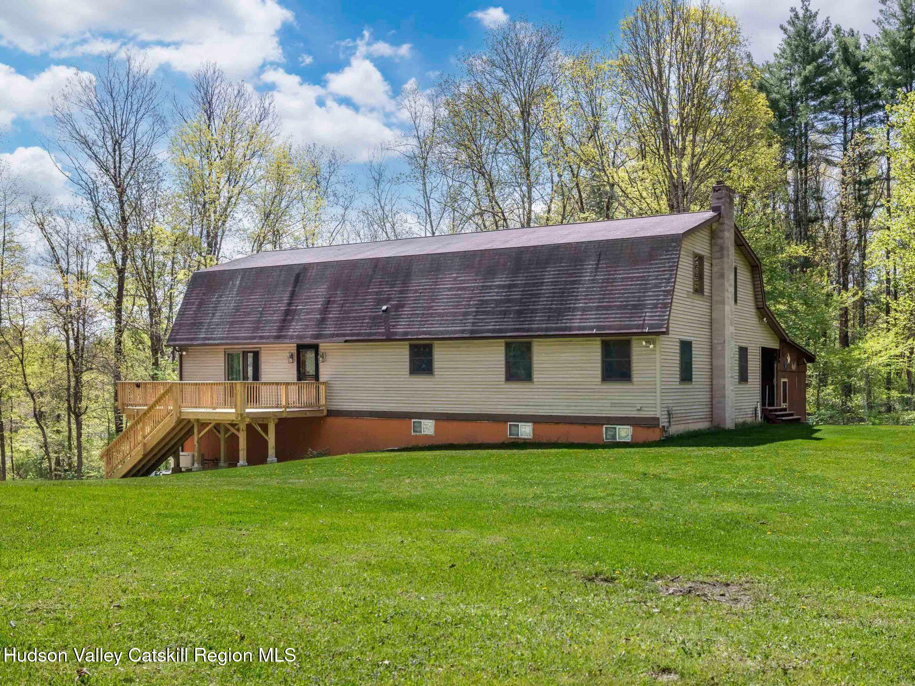 3639 Atwood Road Stone Ridge, NY 12484 - Photo 1 of 31 a front view of a house with garden