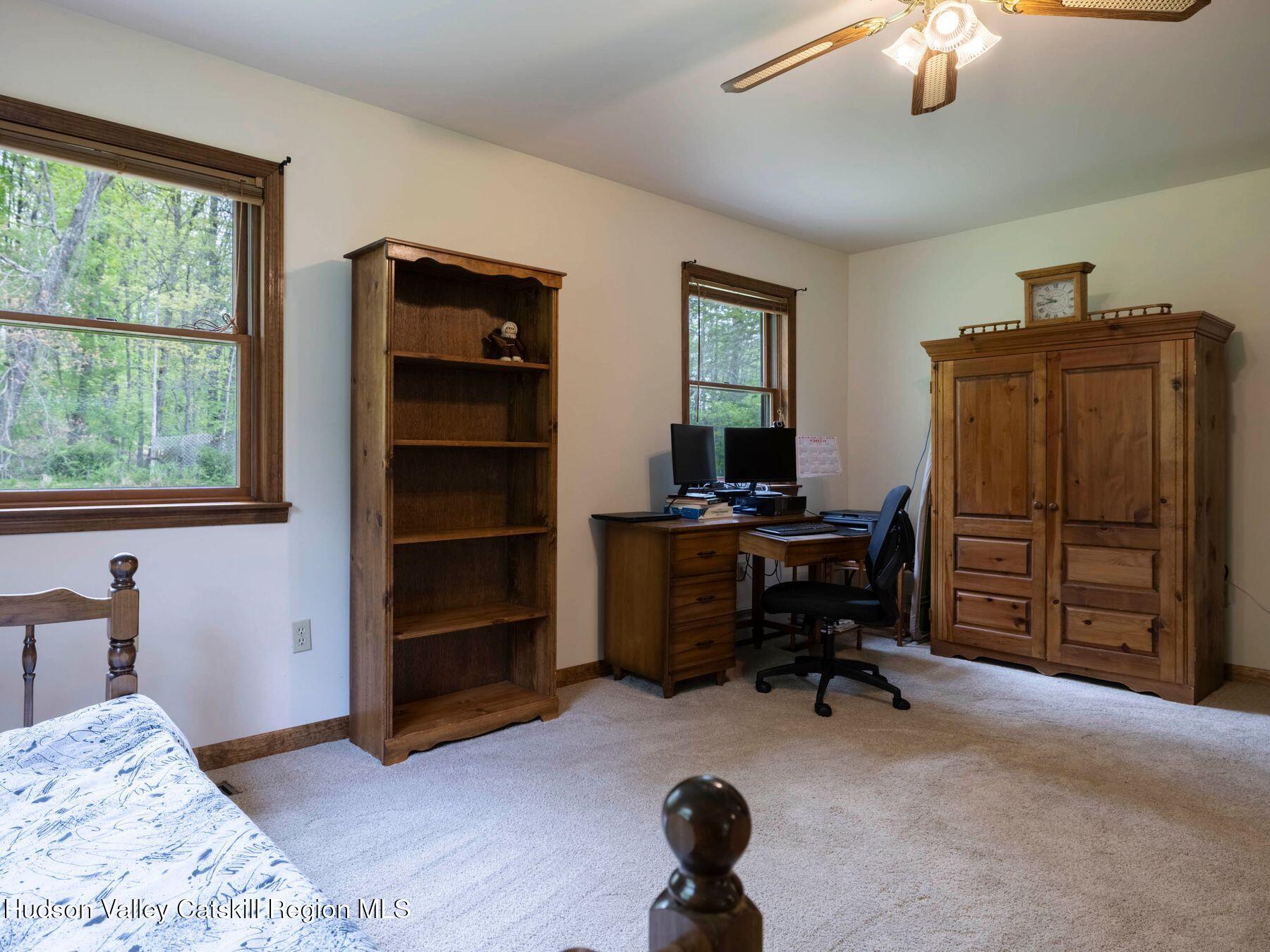 3639 Atwood Road Stone Ridge, NY 12484 - Photo 18 of 31 a view of a workspace with furniture and a window