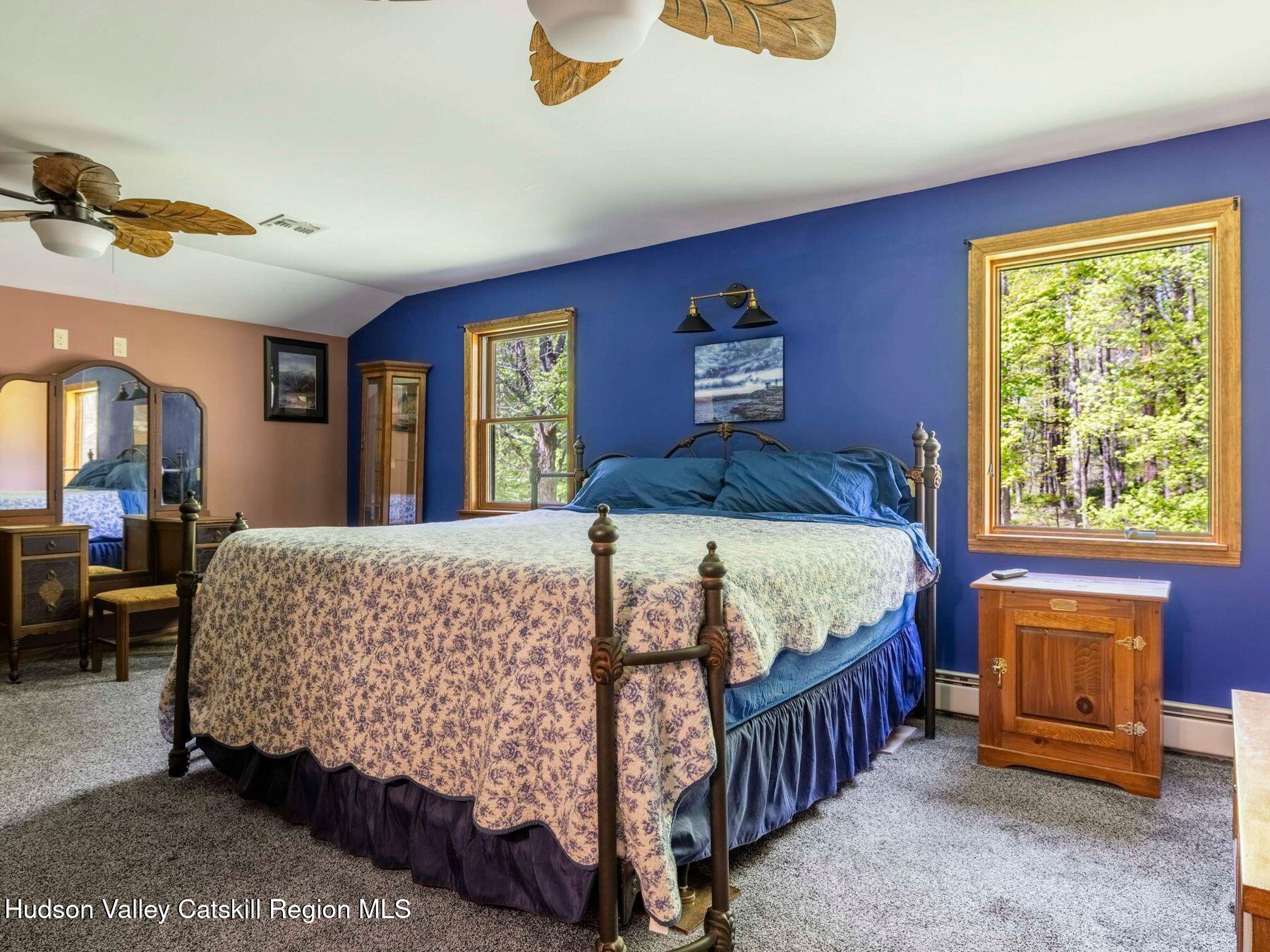 3639 Atwood Road Stone Ridge, NY 12484 - Photo 21 of 31 a bed sitting in a bedroom next to a window