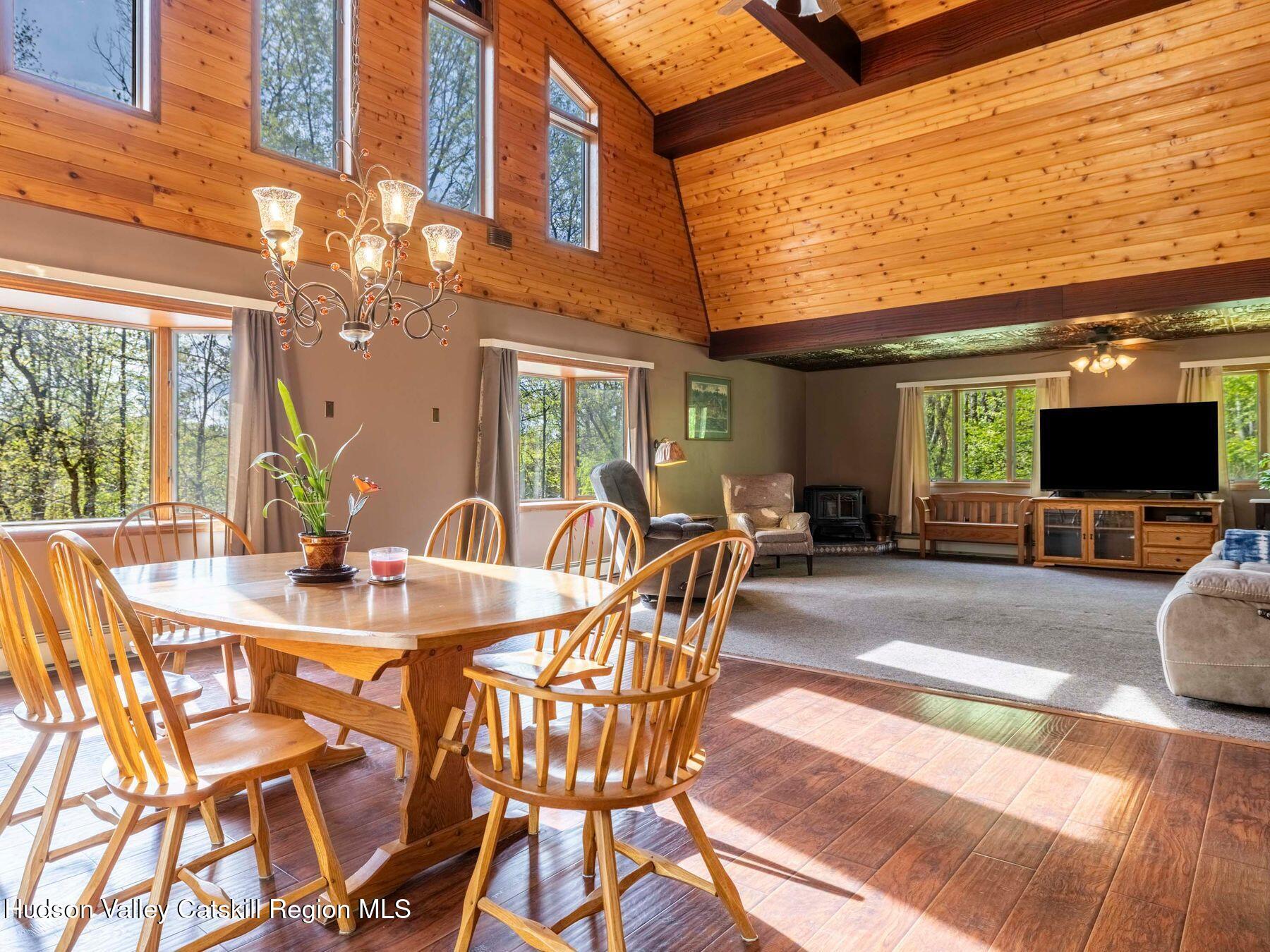 3639 Atwood Road Stone Ridge, NY 12484 - Photo 4 of 31 a view of a dining room with furniture and a flat screen tv