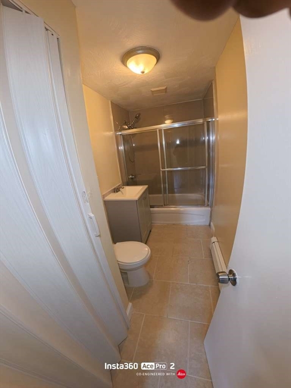 12 Webster Court, Unit 3 Lawrence, MA 01841 - Photo 4 of 4 a bathroom with a toilet and a shower