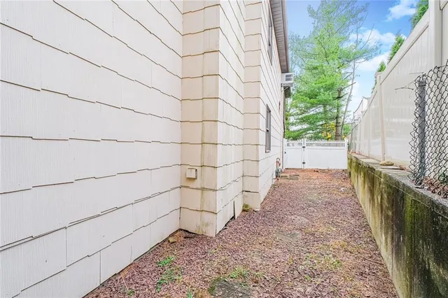 a view of an empty room with a wooden door