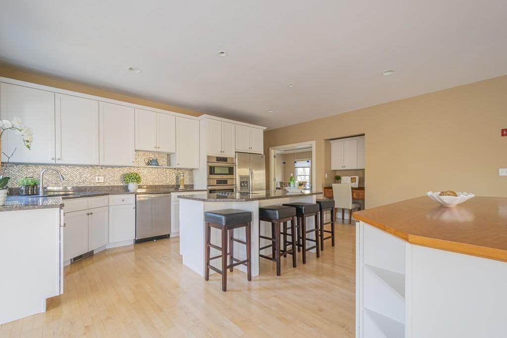 6 Johnson Farm Road Lexington, MA 02420 - Photo 14 of 42 a open kitchen with cabinets table and chairs