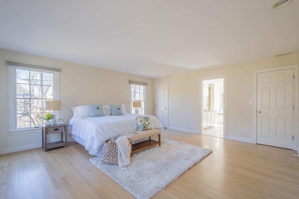 6 Johnson Farm Road Lexington, MA 02420 - Photo 24 of 42 a spacious bedroom with a bed and wooden floor