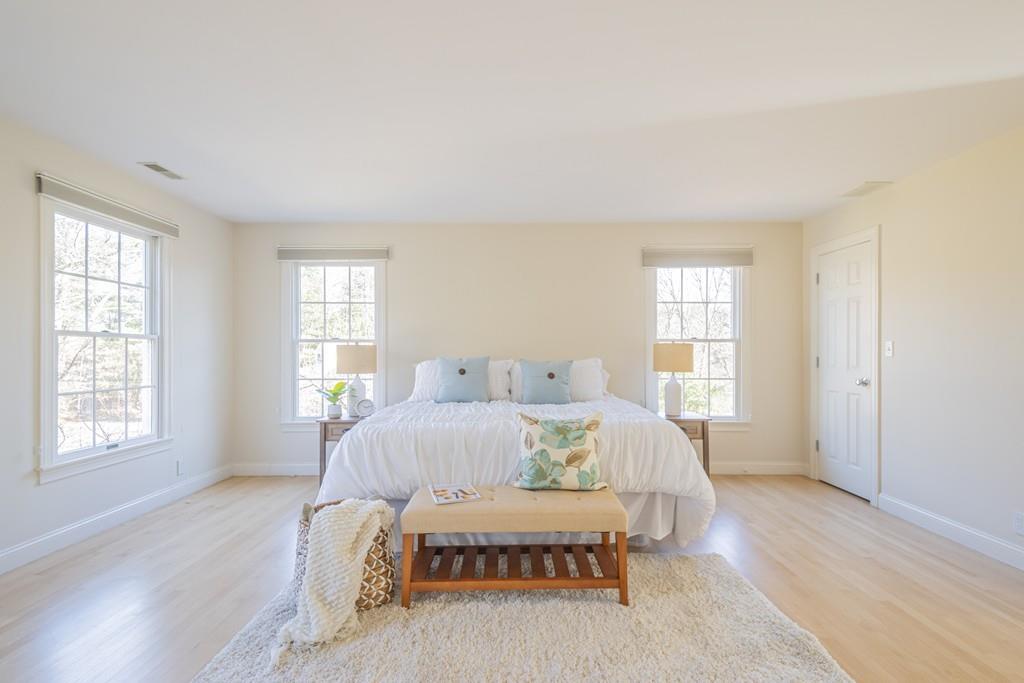 6 Johnson Farm Road Lexington, MA 02420 - Photo 26 of 42 a bedroom with a bed and wooden floor