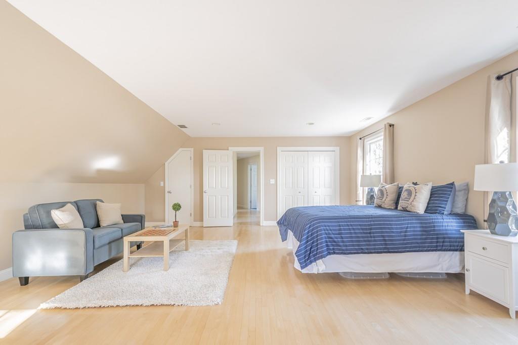 6 Johnson Farm Road Lexington, MA 02420 - Photo 30 of 42 a spacious bedroom with a bed a table and chair