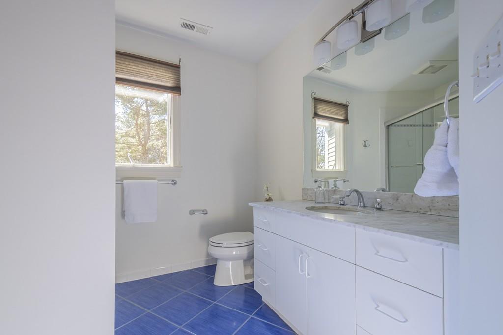 6 Johnson Farm Road Lexington, MA 02420 - Photo 34 of 42 a bathroom with a granite countertop sink toilet and mirror