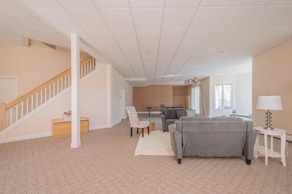 6 Johnson Farm Road Lexington, MA 02420 - Photo 35 of 42 a living room with furniture and a large window