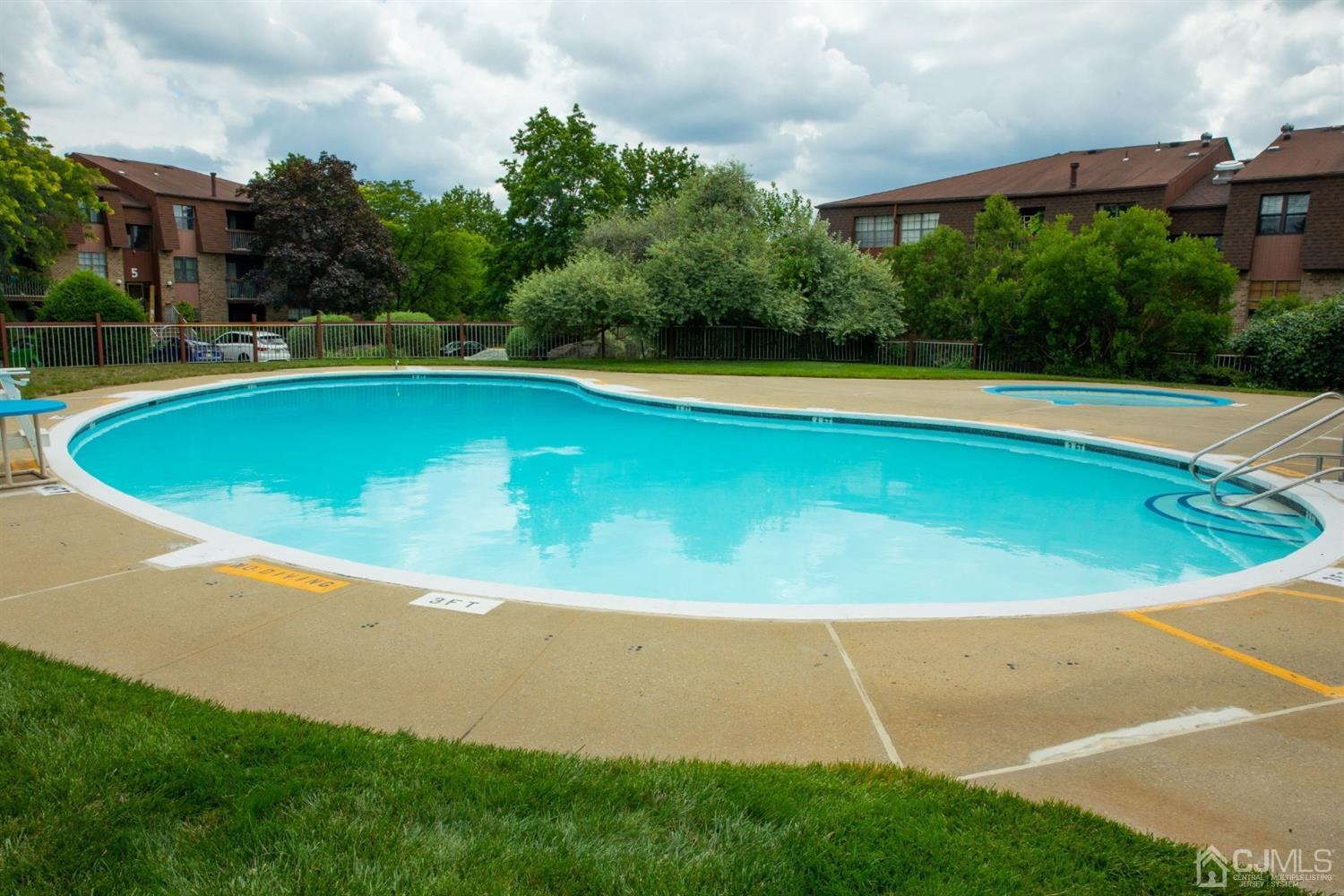 111 Keystone Court, Unit A Woodbridge, NJ 07095 - Photo 1 of 33 a view of outdoor space and swimming pool
