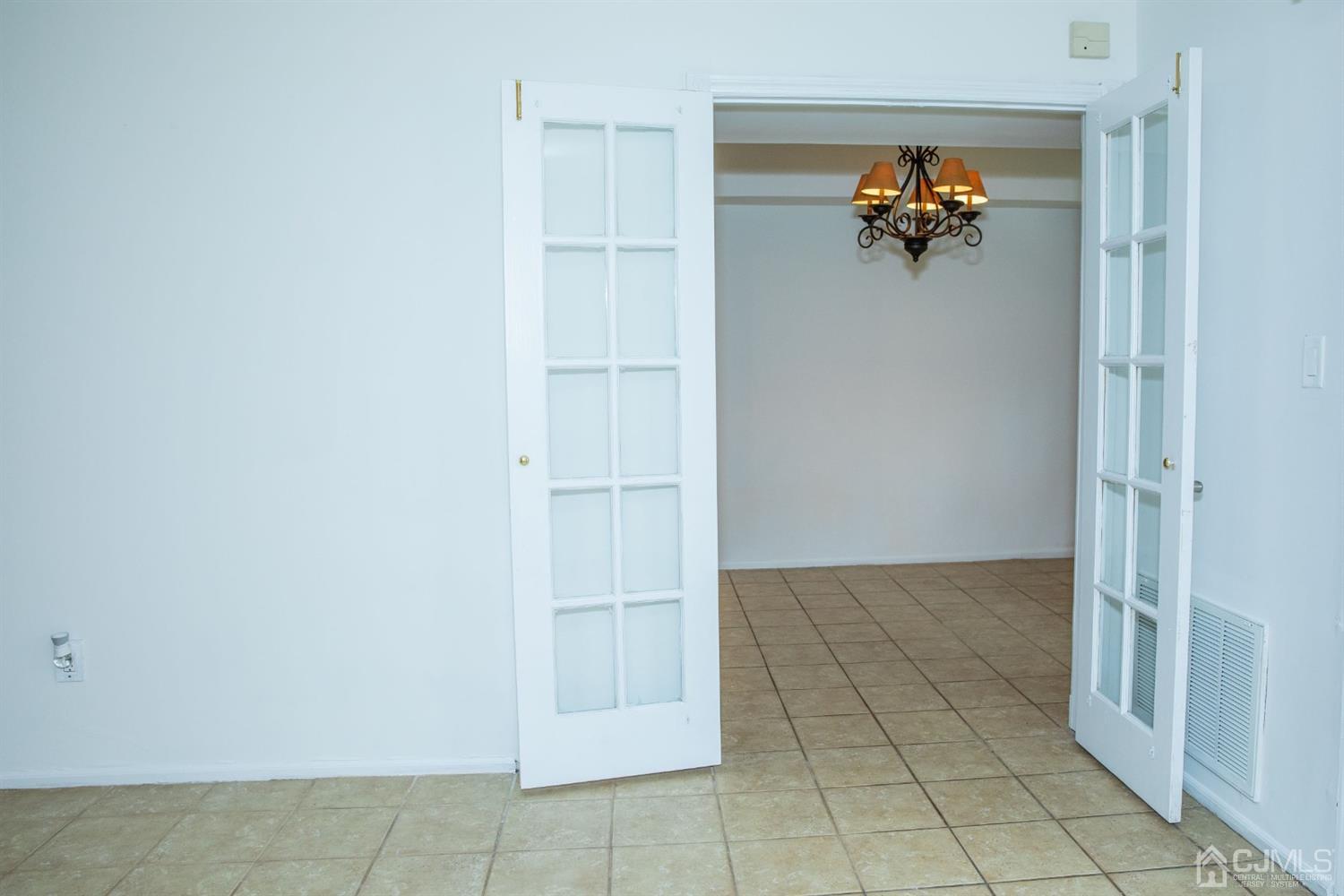 111 Keystone Court, Unit A Woodbridge, NJ 07095 - Photo 13 of 33 an empty room with white walls and door