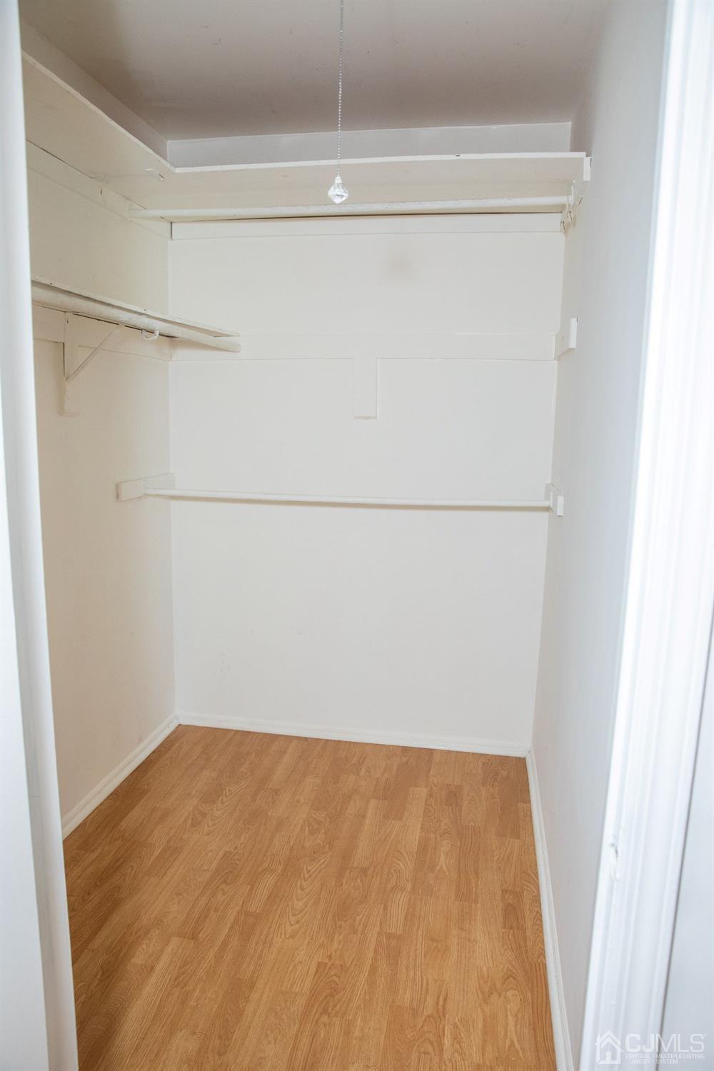 111 Keystone Court, Unit A Woodbridge, NJ 07095 - Photo 22 of 33 a view of a room with racks on the wall