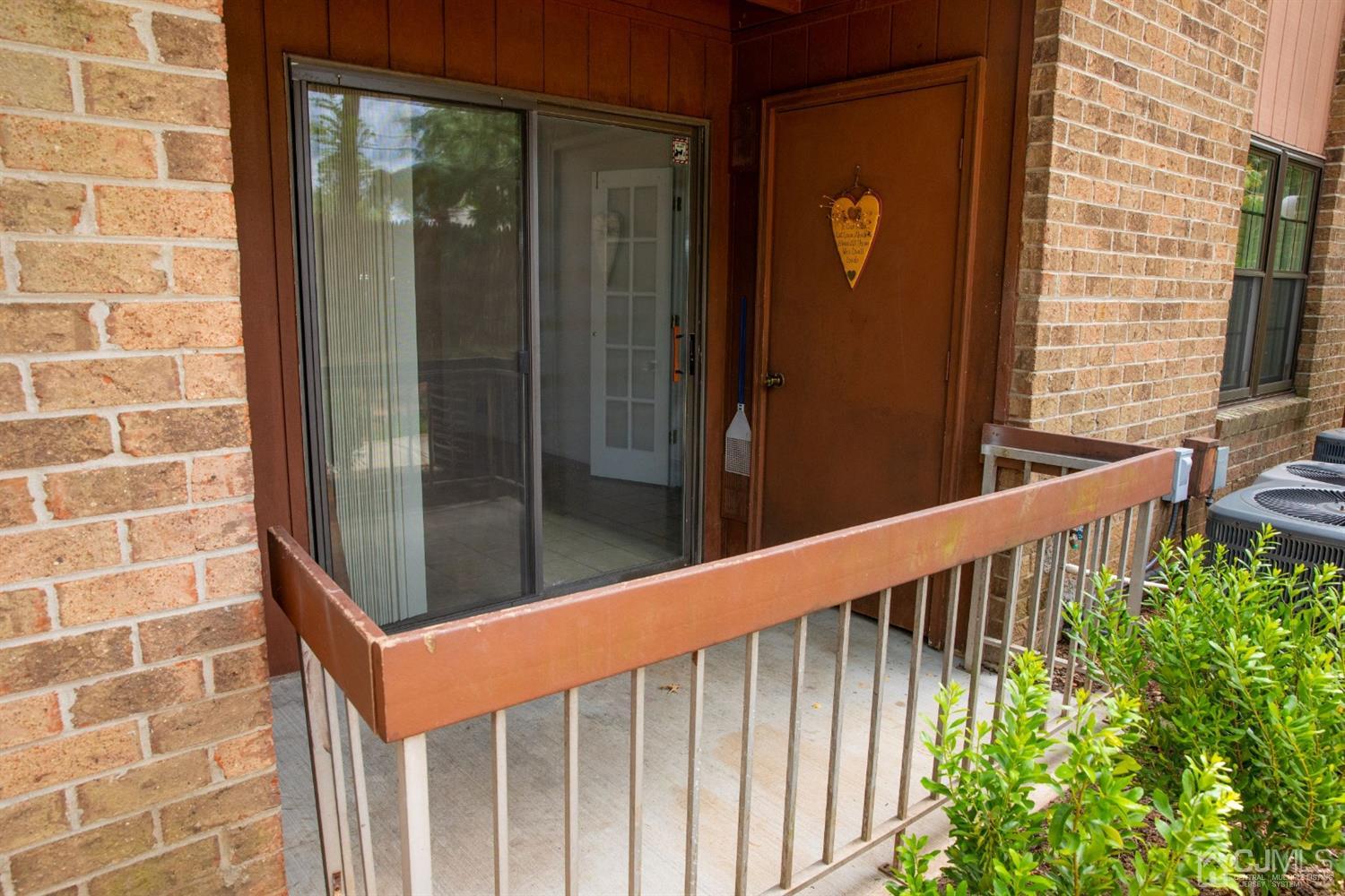 111 Keystone Court, Unit A Woodbridge, NJ 07095 - Photo 4 of 33 a view of balcony with wooden floor