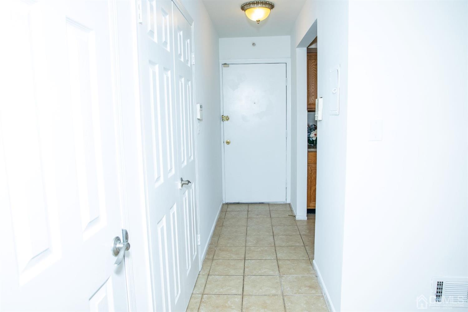 111 Keystone Court, Unit A Woodbridge, NJ 07095 - Photo 5 of 33 a view of a hallway