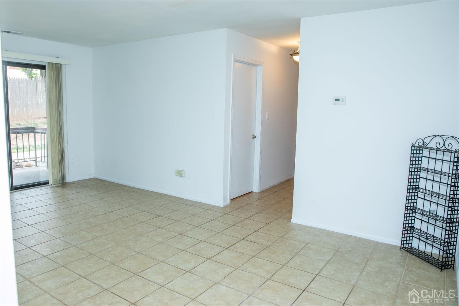 111 Keystone Court, Unit A Woodbridge, NJ 07095 - Photo 7 of 33 an empty room with windows