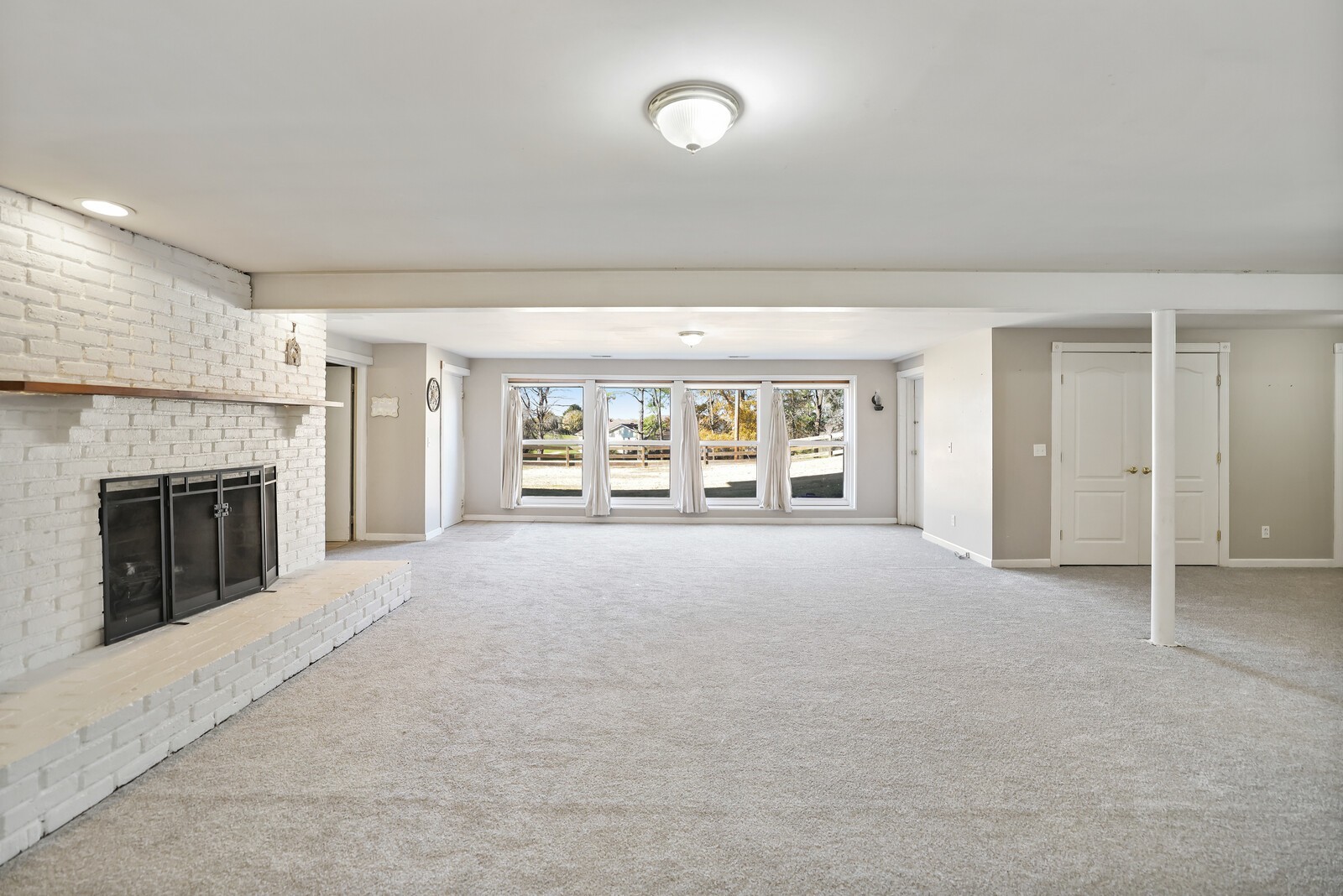676 Ferguson Hill Road Lafayette, TN 37083 - Photo 59 of 89 a view of an empty room with a fireplace and a window