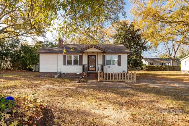 a house with trees in the background