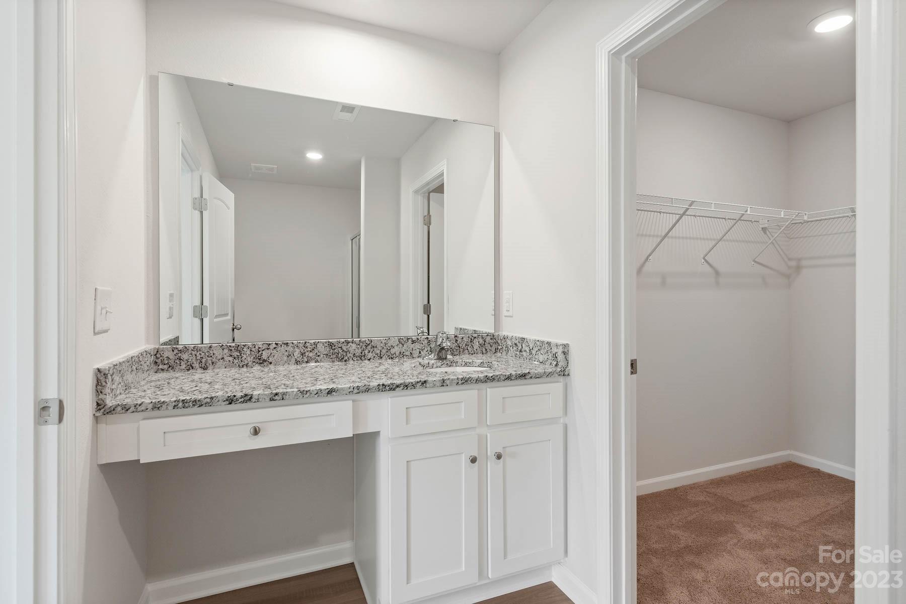 1612 Nia Road Charlotte, NC 28215 - Photo 13 of 15 a bathroom with a granite countertop sink and a mirror