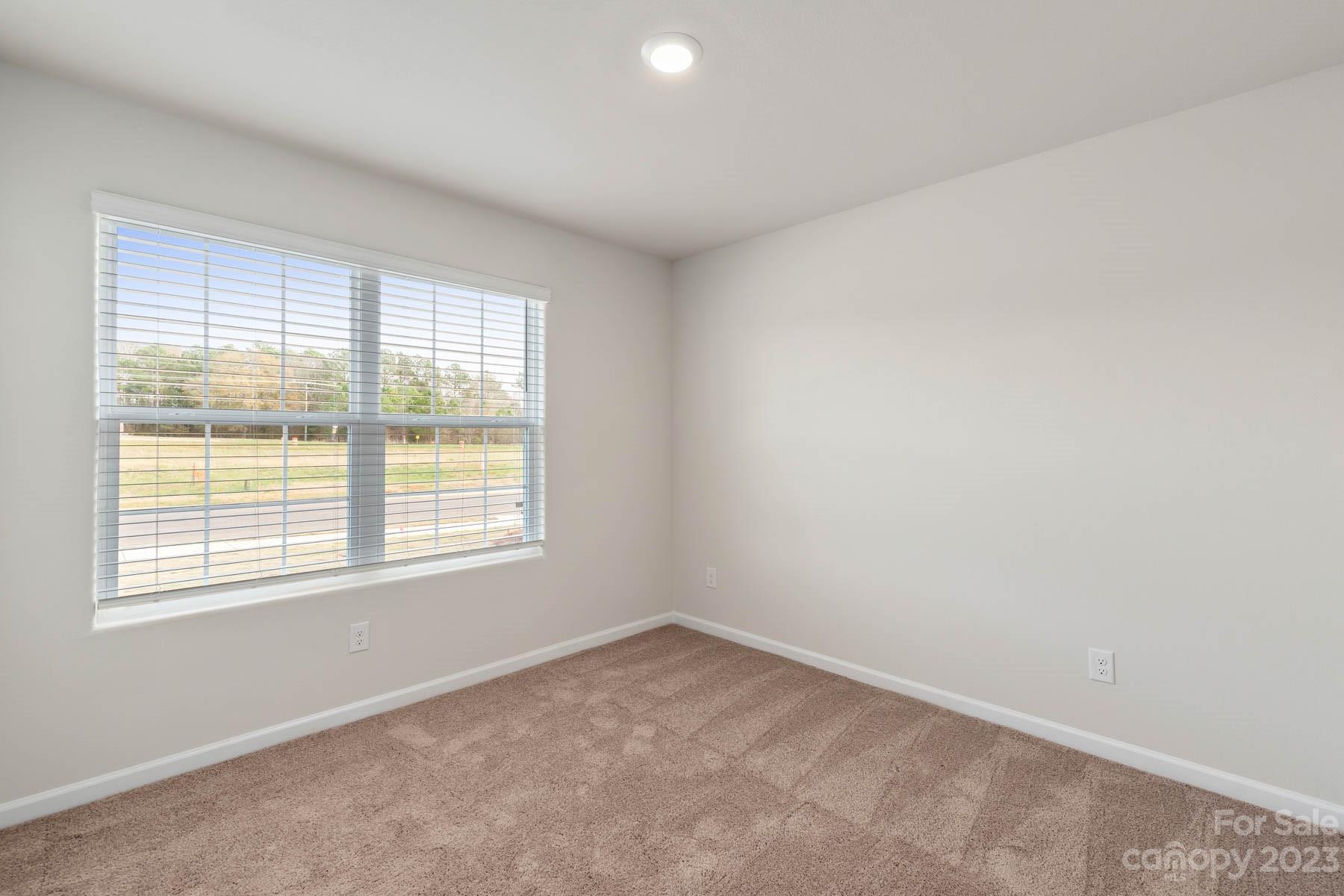1612 Nia Road Charlotte, NC 28215 - Photo 14 of 15 an empty room with a window