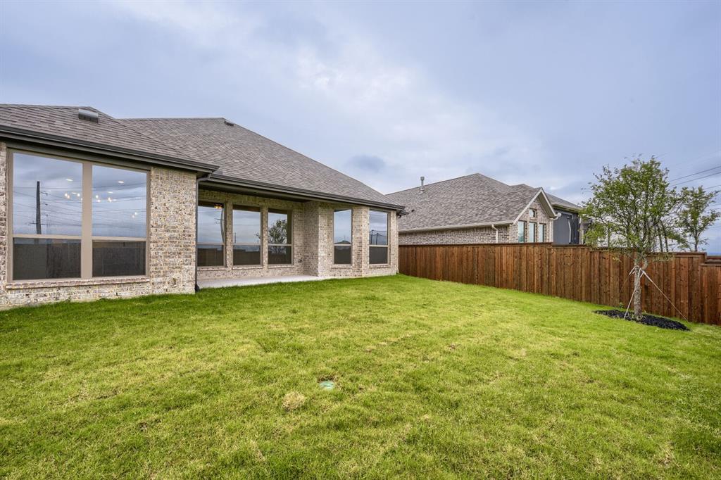 242 Buffalo Boulevard Rhome, TX 76078 - Photo 28 of 28 a view of a house with a garden
