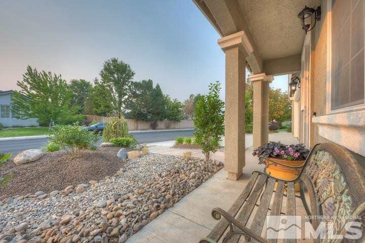 10520 Baton Court Reno, NV 89521 - Photo 24 of 38 a view of a porch with furniture and a yard