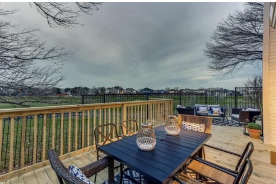 swimming pool view with a seating space