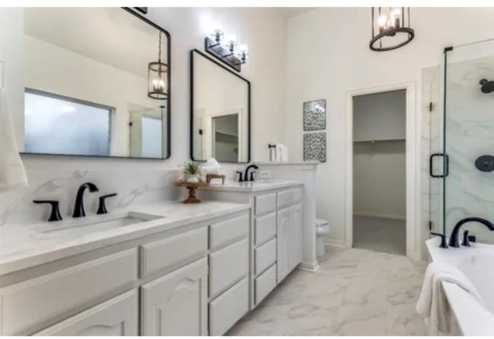 1377 Riley Drive Carrollton, TX 75007 - Photo 20 of 27 a bathroom with a double vanity sink mirror and shower