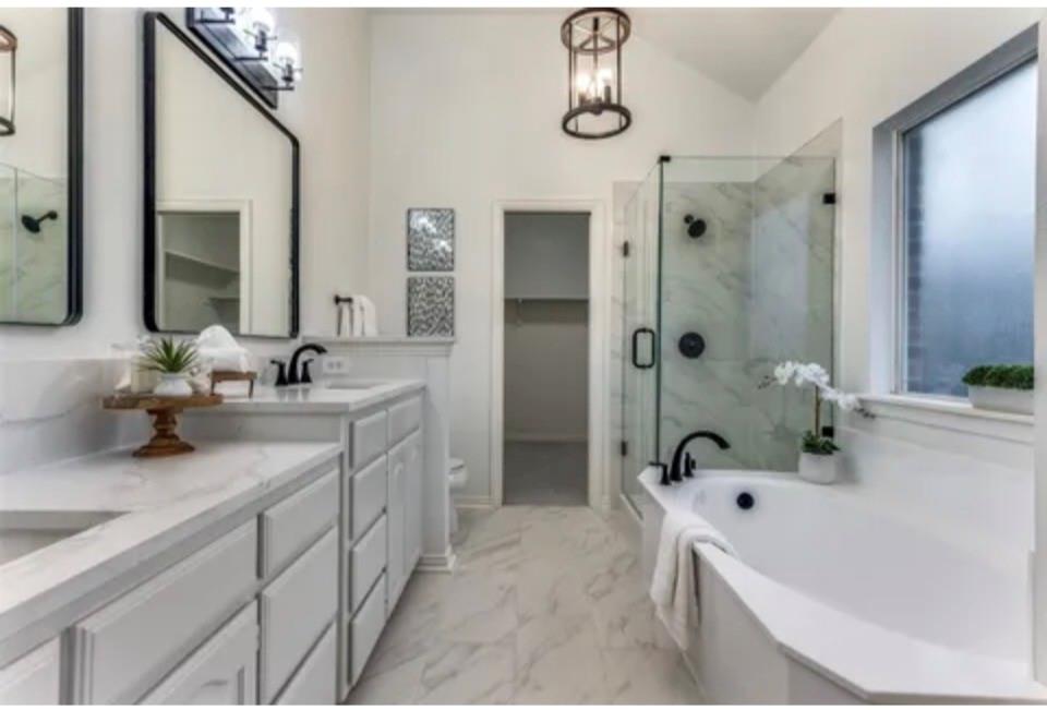 1377 Riley Drive Carrollton, TX 75007 - Photo 21 of 27 a bathroom with a tub a sink and mirror
