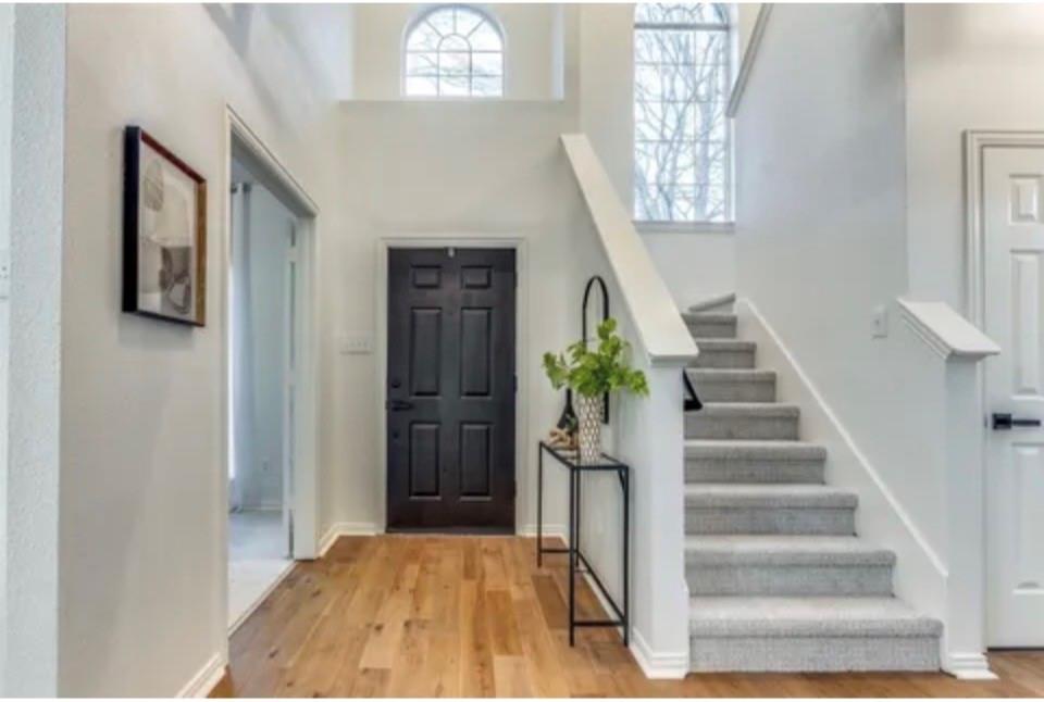 1377 Riley Drive Carrollton, TX 75007 - Photo 4 of 27 a view of entryway and hall with wooden floor