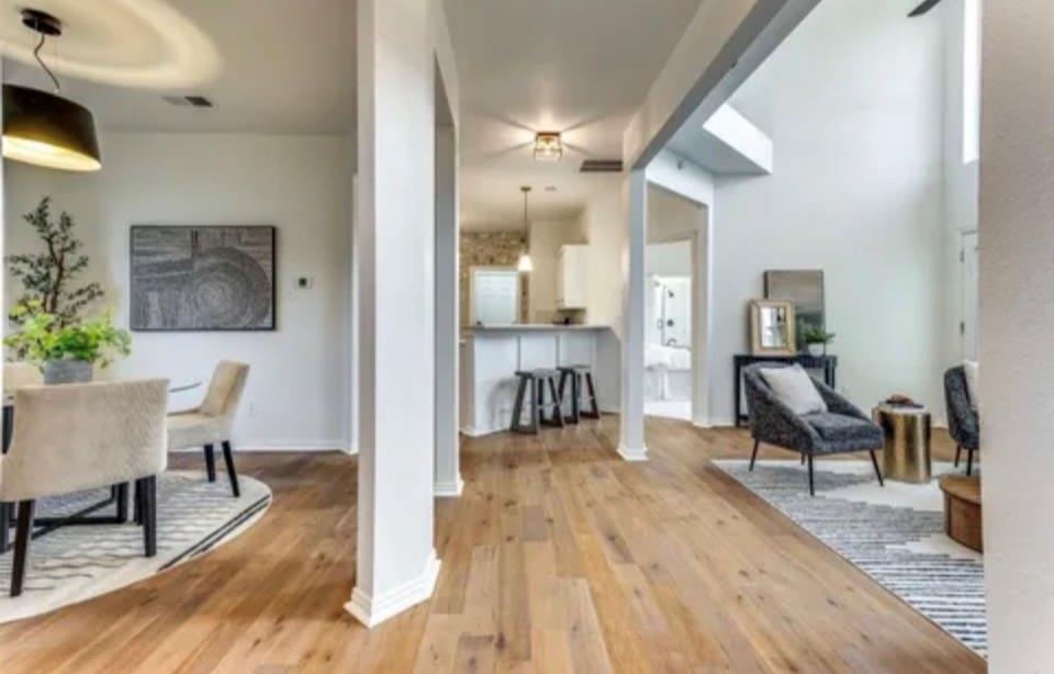 1377 Riley Drive Carrollton, TX 75007 - Photo 5 of 27 a view of a dining room with furniture and wooden floor