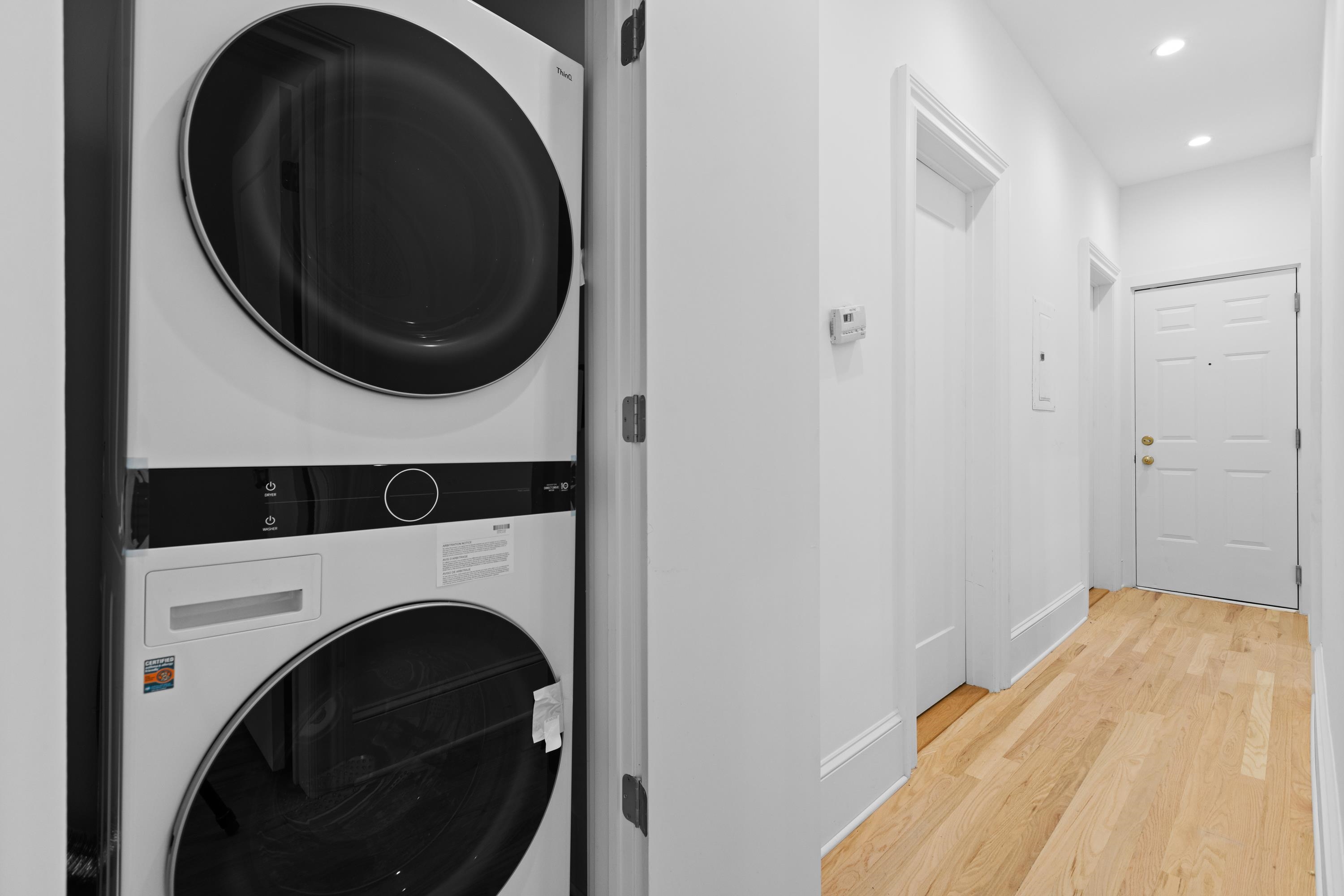 76 Washington Street, Unit 2 Hoboken, NJ 07030 - Photo 11 of 14 a view of a hallway with washer and dryer