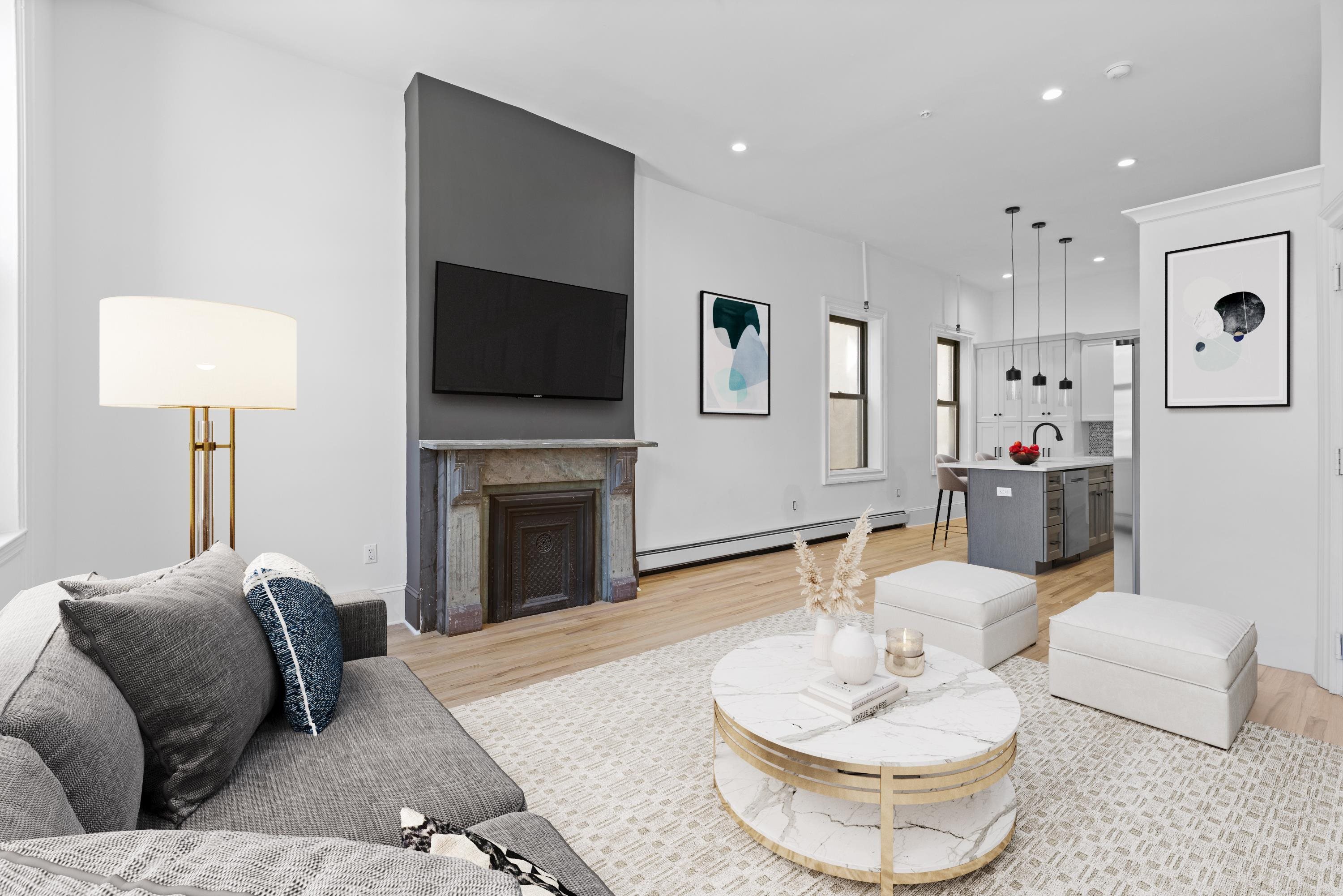 76 Washington Street, Unit 2 Hoboken, NJ 07030 - Photo 3 of 14 a living room with furniture and a fireplace