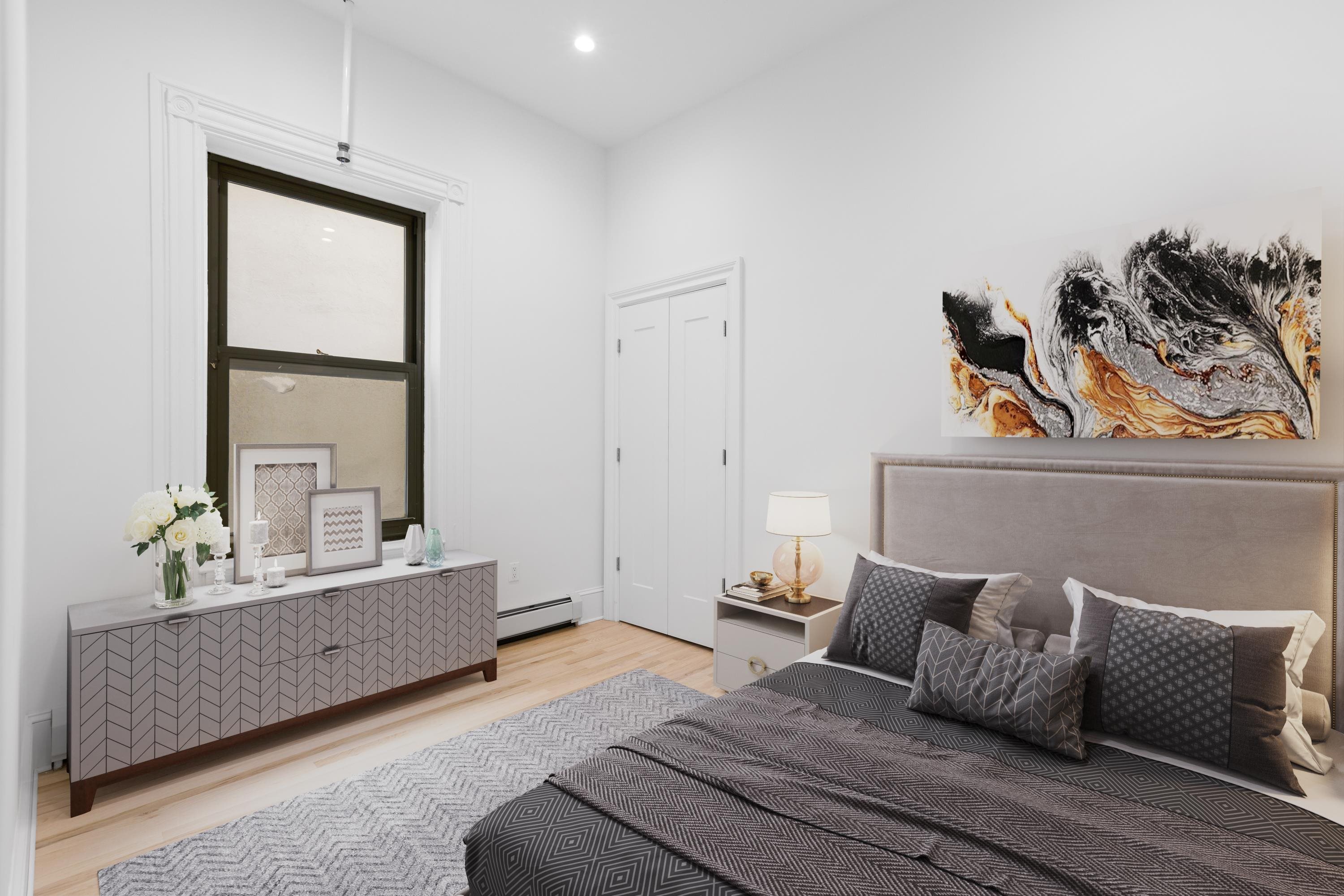 76 Washington Street, Unit 2 Hoboken, NJ 07030 - Photo 6 of 14 a bedroom with furniture and window