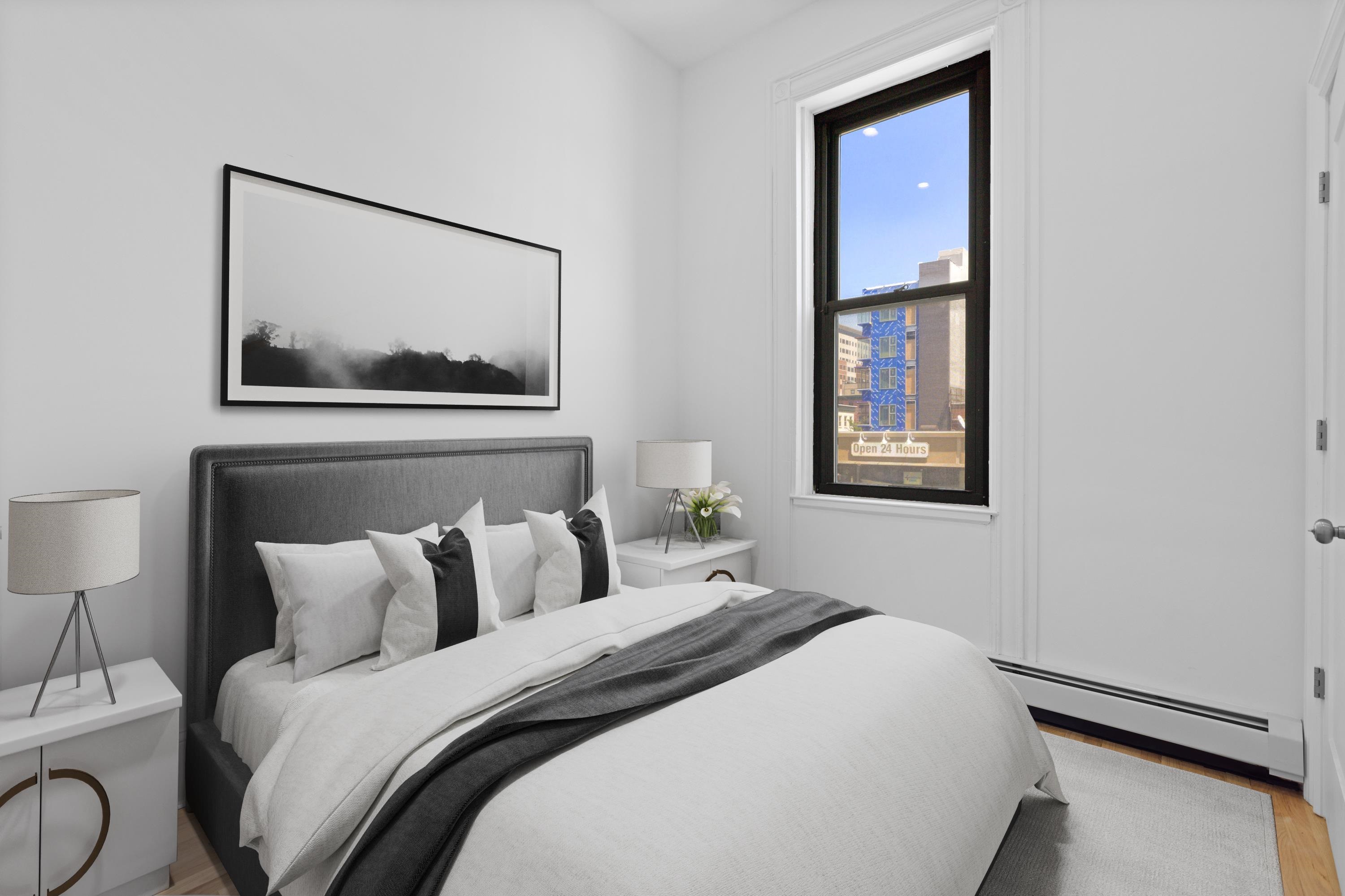 76 Washington Street, Unit 2 Hoboken, NJ 07030 - Photo 7 of 14 a bedroom with bed and a painting on the wall
