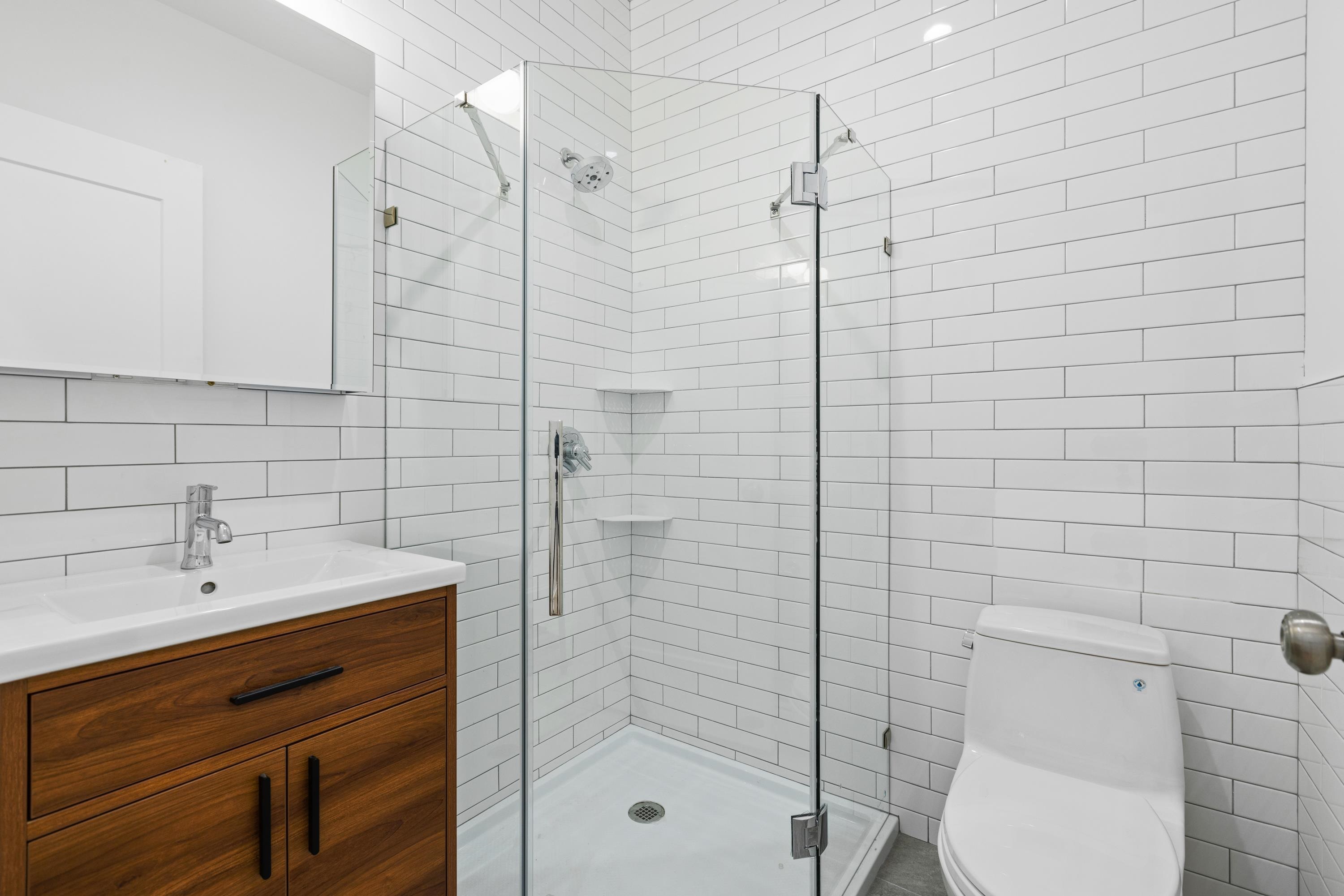 76 Washington Street, Unit 2 Hoboken, NJ 07030 - Photo 9 of 14 a bathroom with a shower toilet and sink