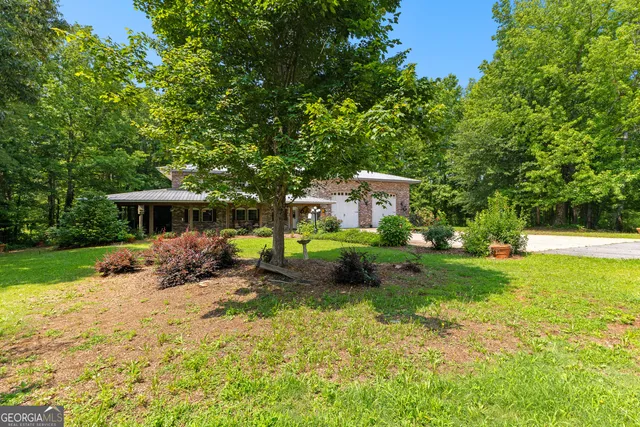 a view of a porch with furniture and yard