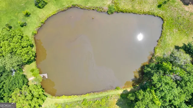 a view of a swimming pool with an outdoor space and seating area