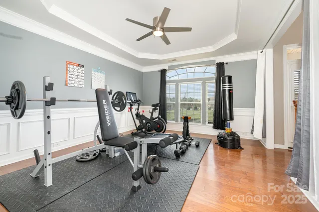 a view of a livingroom with workspace and a window