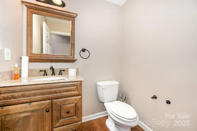 a white toilet sitting next to a bathroom sink