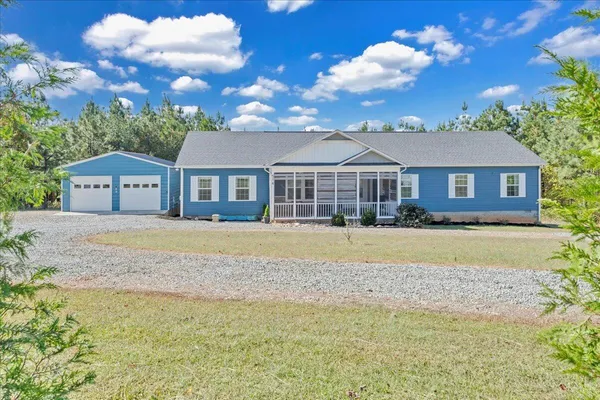 a house with swimming pool in front of it