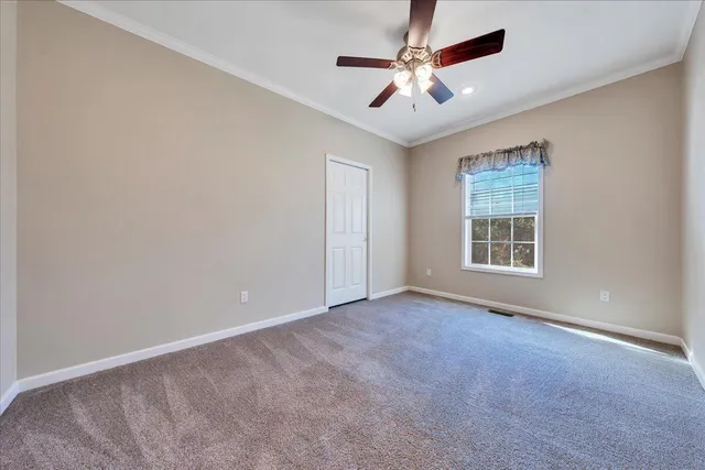 a room with granite countertop cabinets and wooden floor
