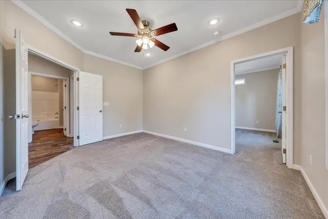 a view of hallway with wooden floor