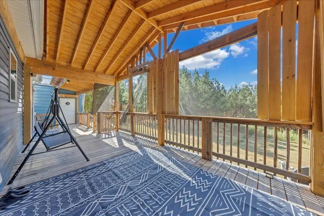 a view of a two chairs in the balcony