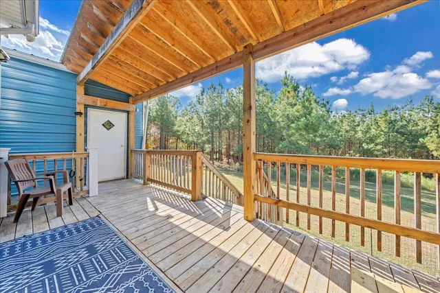 a view of a house with swimming pool and sitting area