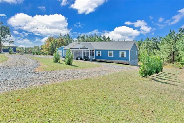 a view of a lake with green field