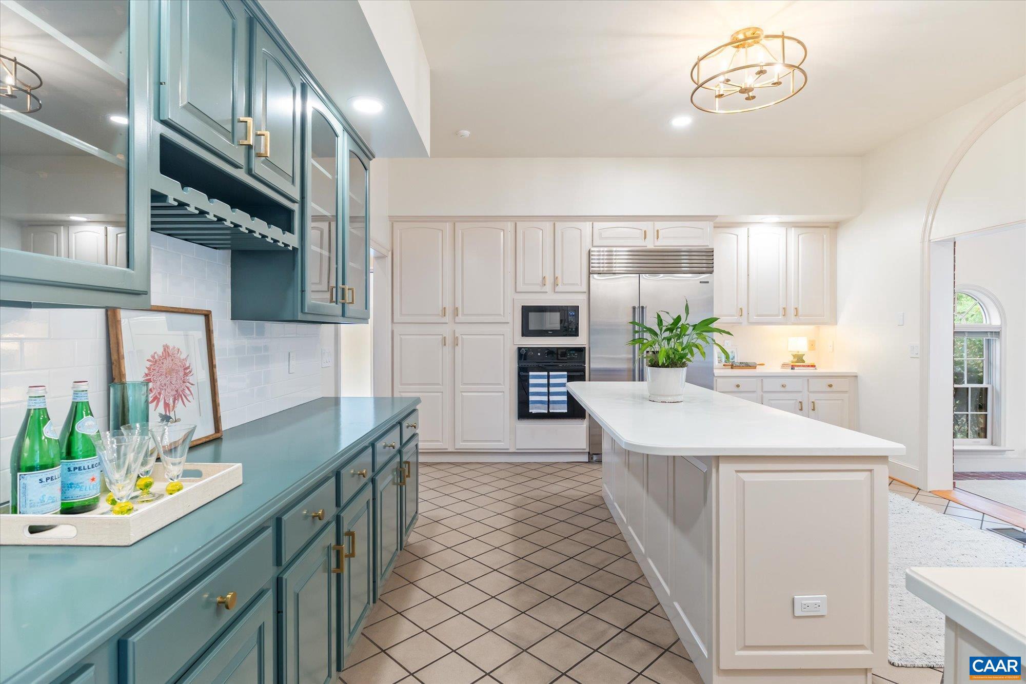 1462 Owensville Road Charlottesville, VA 22901 - Photo 19 of 56 a kitchen with stainless steel appliances kitchen island granite countertop a sink and cabinets