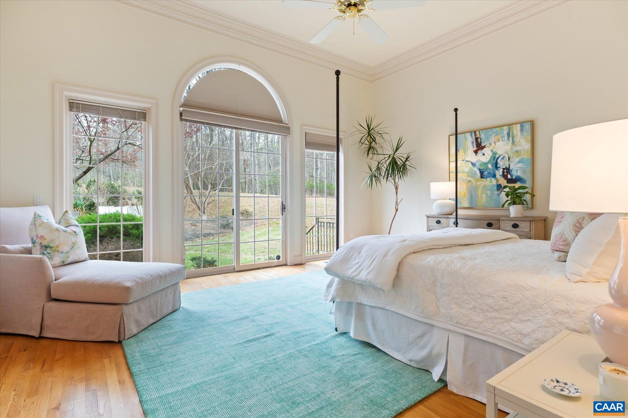 1462 Owensville Road Charlottesville, VA 22901 - Photo 29 of 56 a spacious bedroom with a large bed and a large window