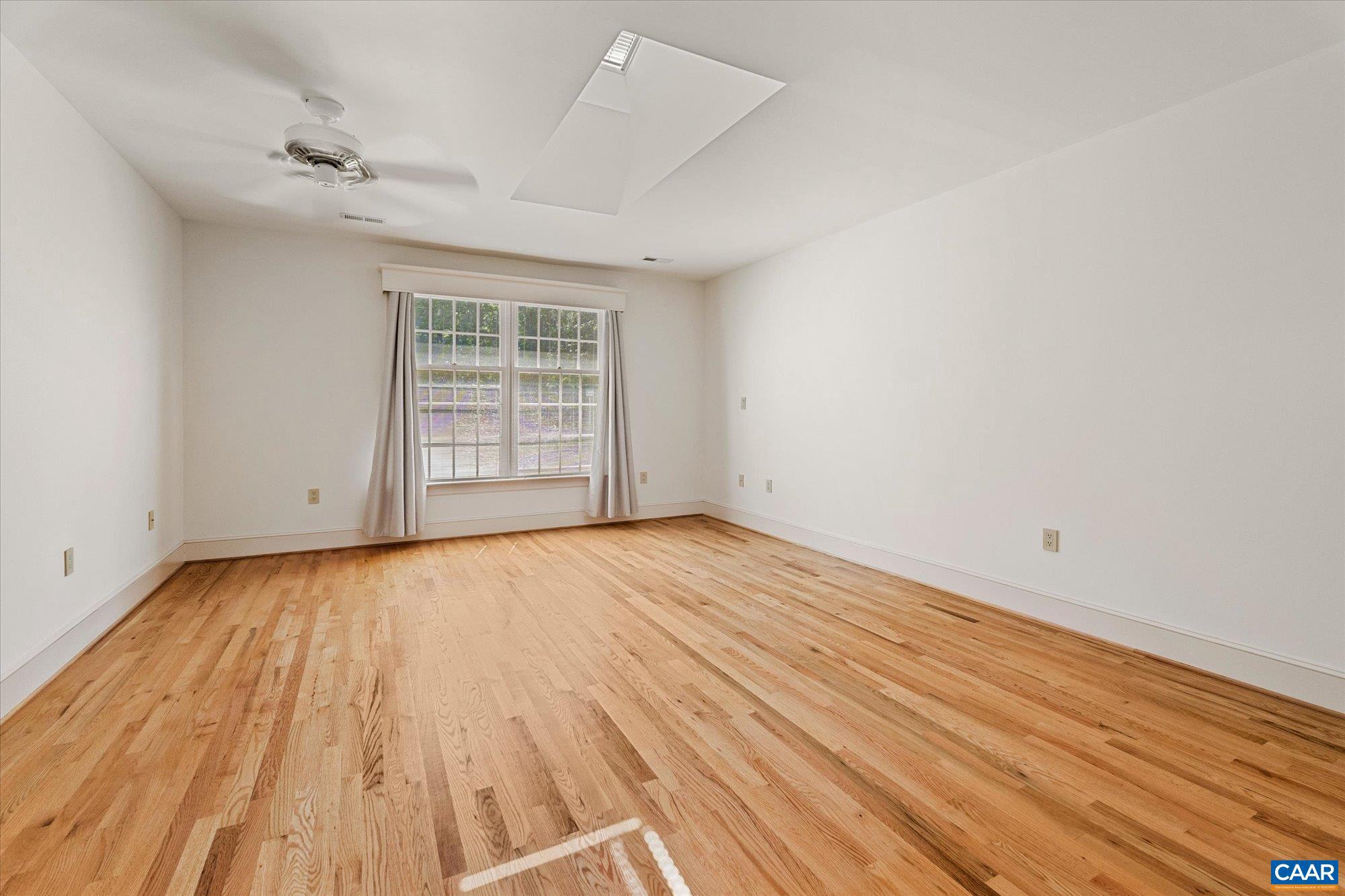 1462 Owensville Road Charlottesville, VA 22901 - Photo 38 of 56 wooden floor in an empty room with a window
