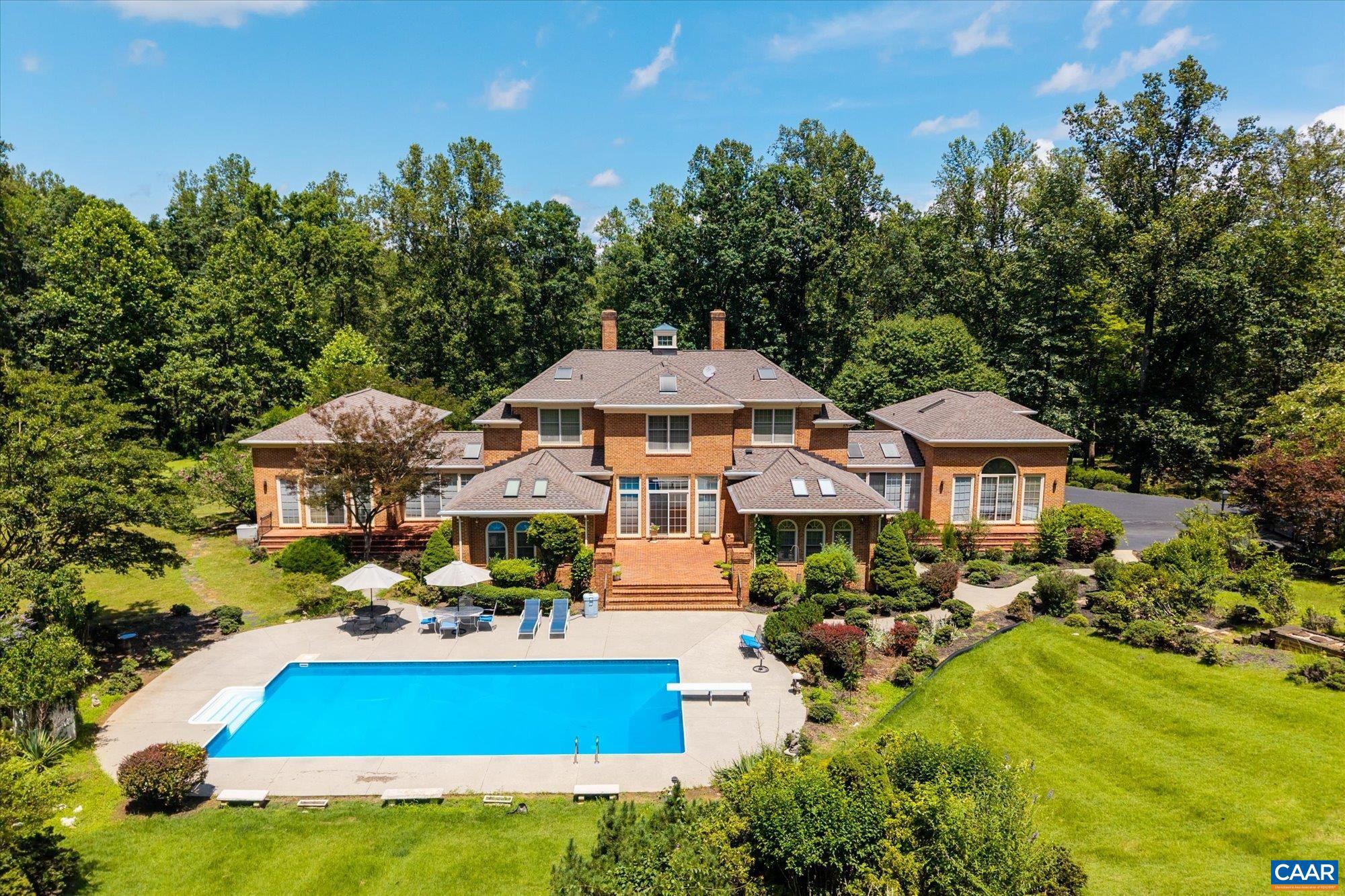 1462 Owensville Road Charlottesville, VA 22901 - Photo 5 of 56 an aerial view of a house with yard swimming pool and outdoor seating